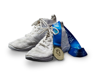 Jake Kravitz's Rebel Cheer Shoes with a gold medal