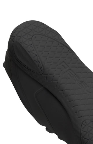 Close-up of a black cheer shoe with textured surface on a white background