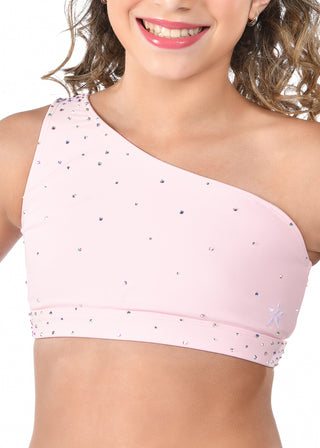 Child wearing a pink sports bra with star pattern on a white background