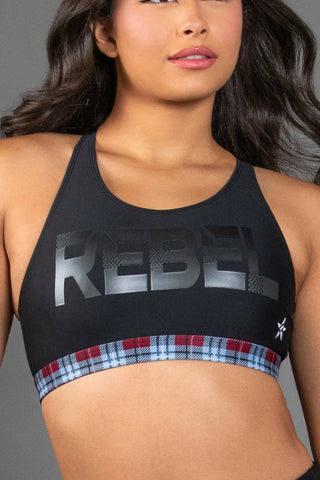 black sports bra with red and white plaid trim